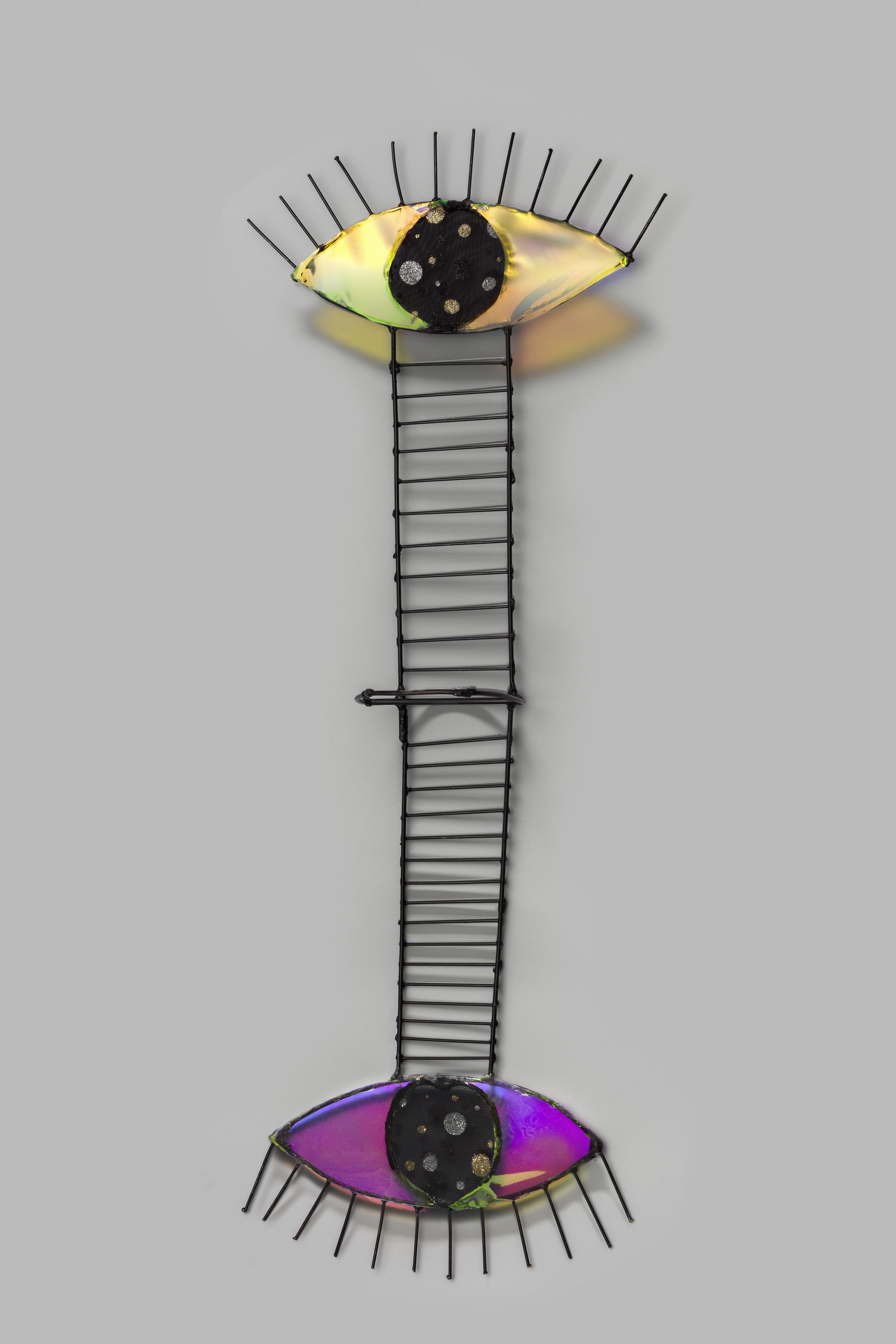 Steel welded wall sculpture with ladder and  an eye at the top and bottom